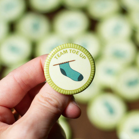 Camp Stitchwood Team Toe Up Merit Badge Pin